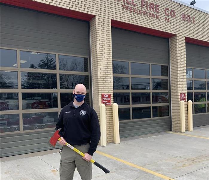 Deputy holding a axe we returned. 