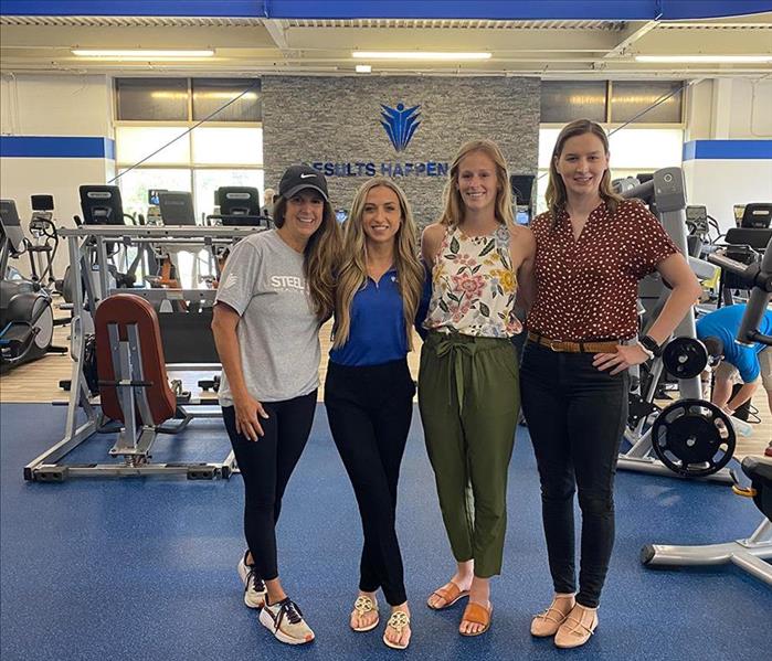 A group of women in a gym 